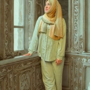 Girl wearing co ords set in mint color.