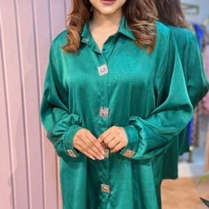 Emerald green silk loose-fit ladies shirt with square liver-colored metal buttons, round neck, 30 inches long, free size fits up to body size 50
