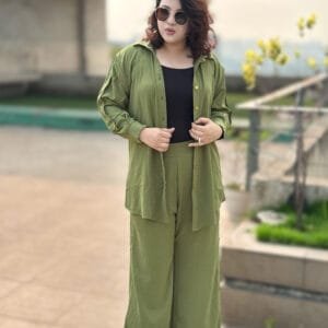 Model wearing olive green co-ord set with drop shoulder shirt and high-waisted wide-leg pants